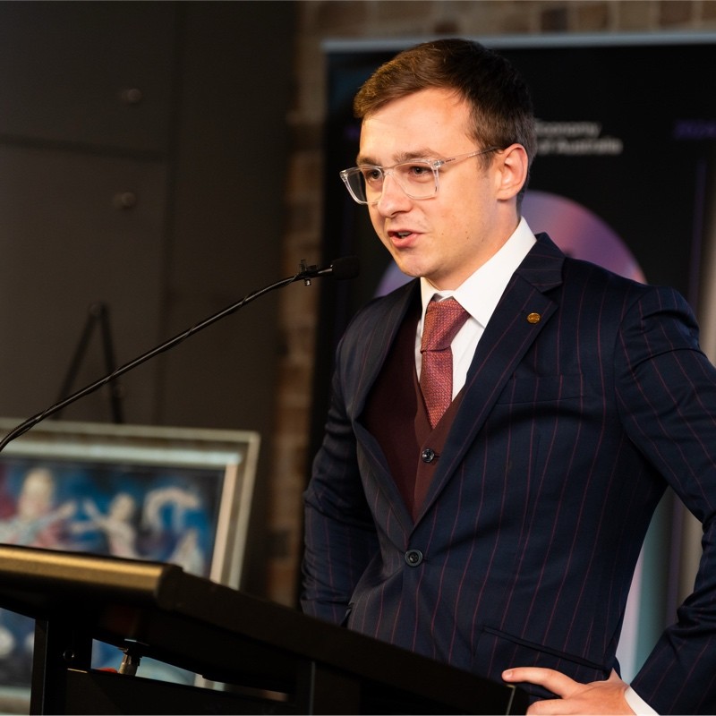 Fletcher Roberts, founder of Scale Thesis, speaking at an event